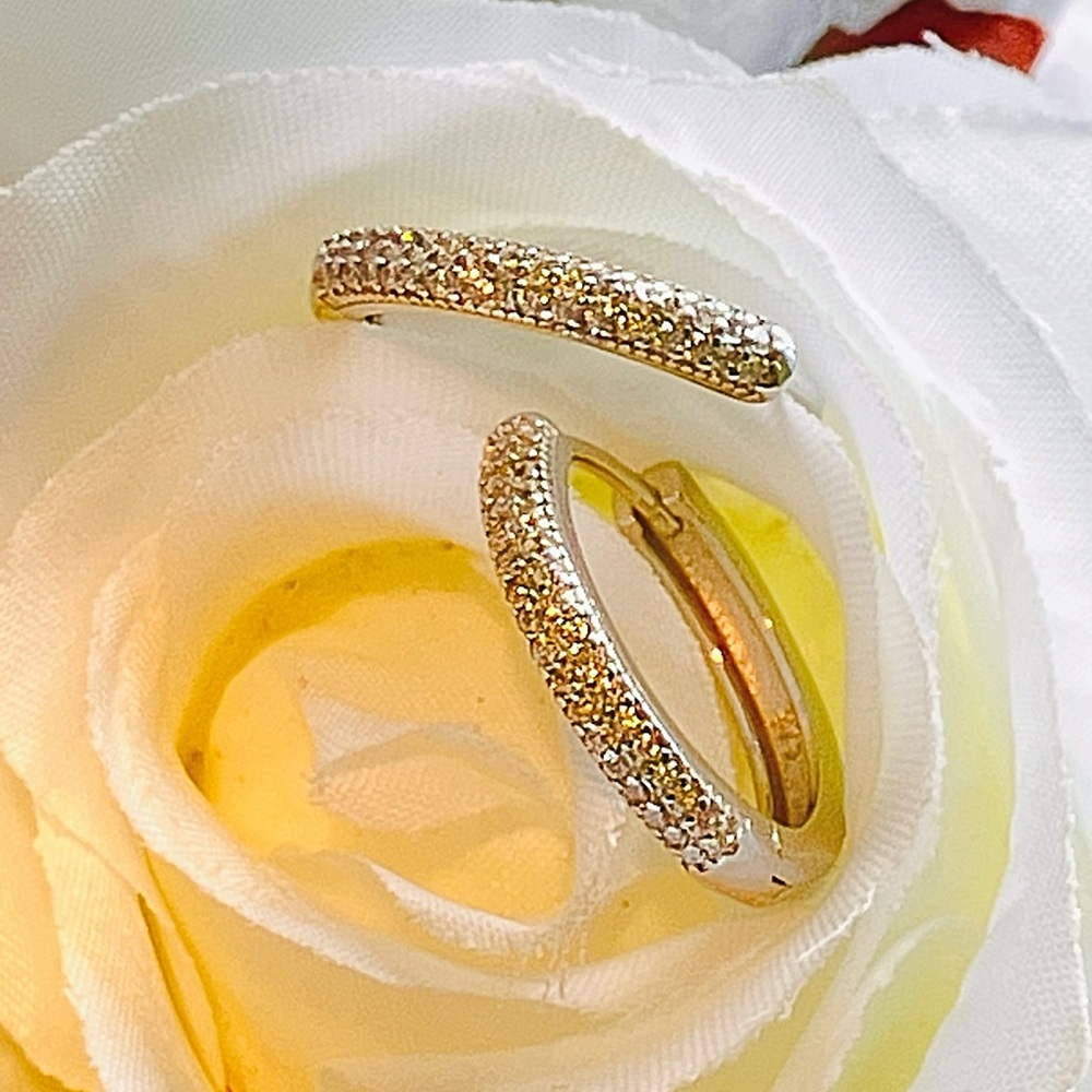 Very nice sterling silver hoop earrings that features high quality, AAA CZ’s